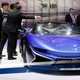 The Chinese carmaker Qiantu stand showing off the company’s all-electric roadster. Photo Credit: AP